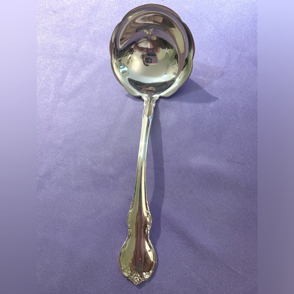 Towel French provincial gravy ladle.